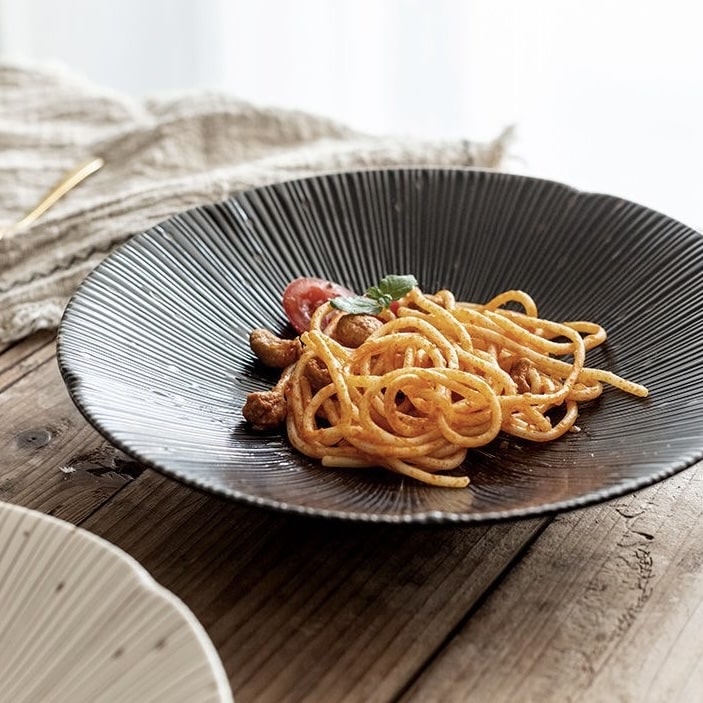 Ivory sunburst-patterned dish with fresh fruits