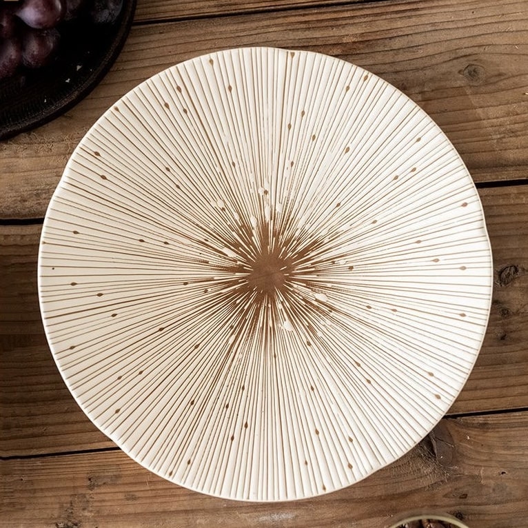 Elegant black ceramic plate displayed on a wooden table