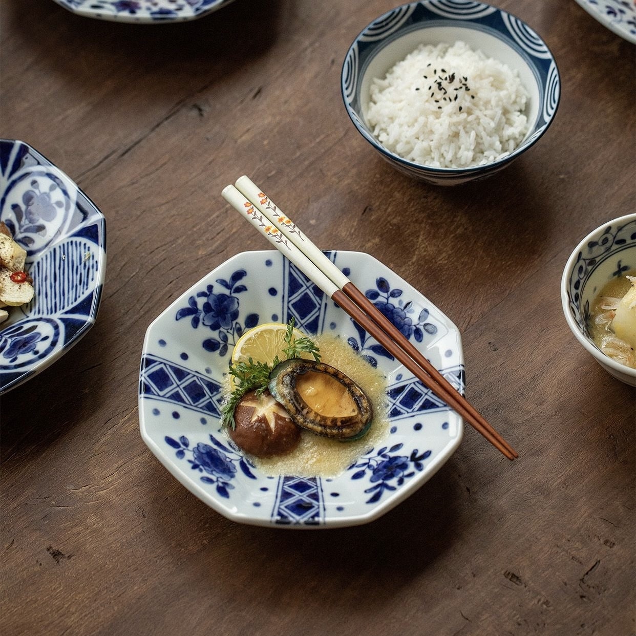 Floral-patterned chopsticks paired with traditional Japanese tableware