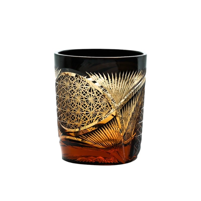 Vintage whiskey glass with Japanese crane feather pattern in amber crystal, featuring Edo Kiriko craftsmanship.
