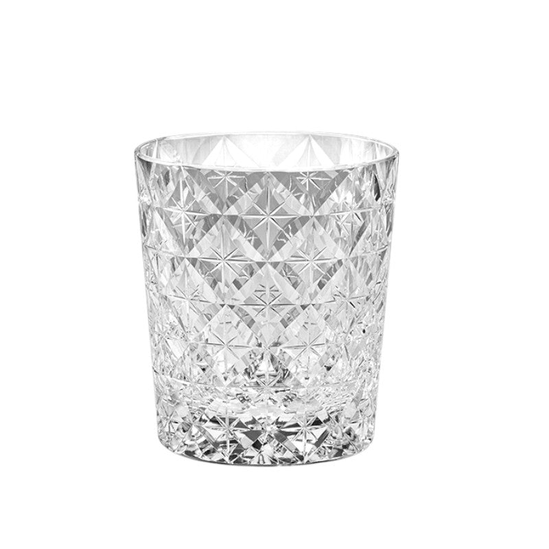 Close-up of European-inspired crystal whiskey glass showcasing intricate cut design.
