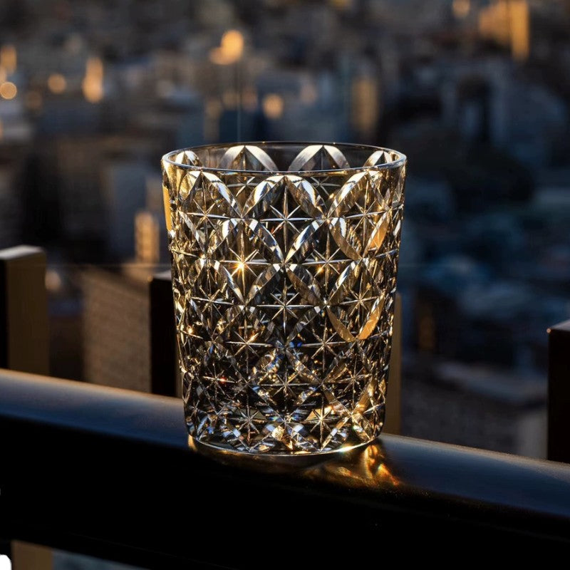 Close-up of European-inspired crystal whiskey glass showcasing intricate cut design.
