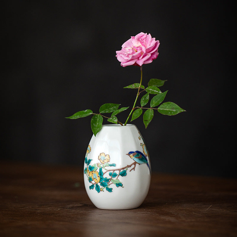 Hand-painted Japanese ceramic vase on wooden table