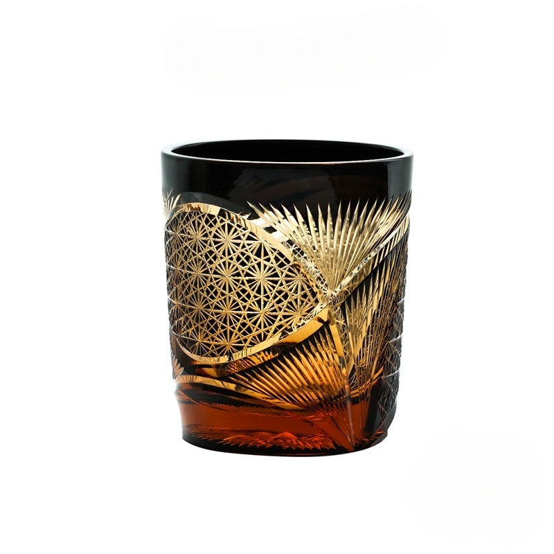 Handcrafted vintage Edo Kiriko whiskey glass with crane feather motif in amber crystal.