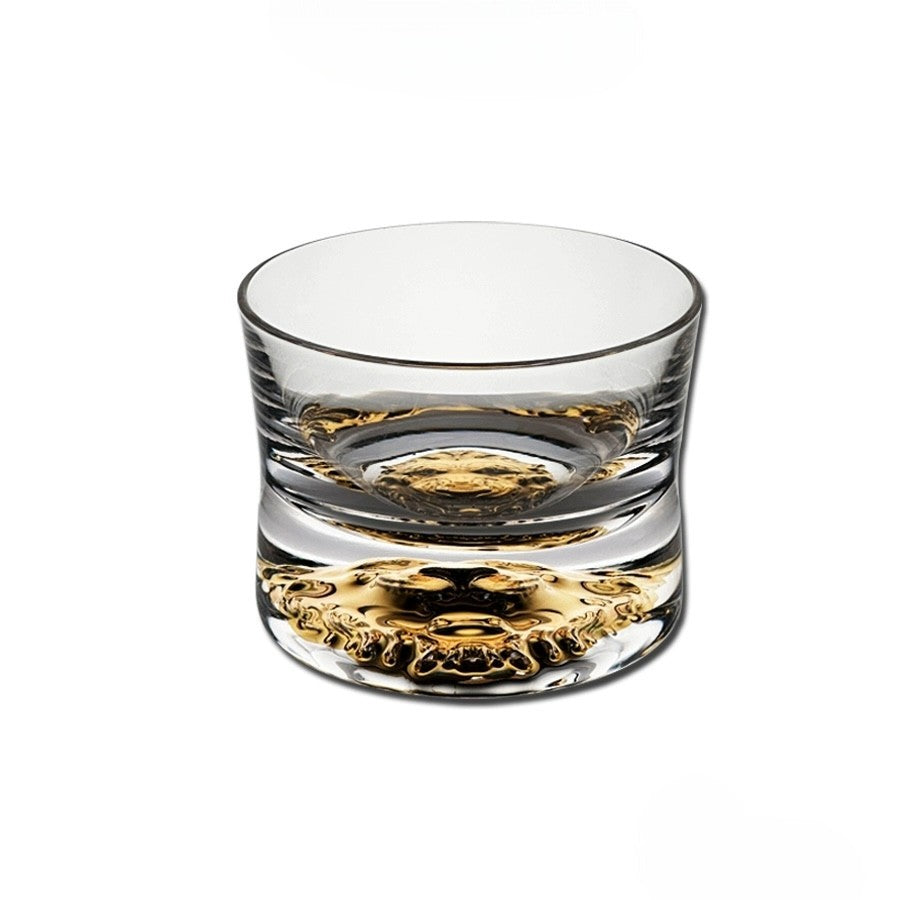 Minimalist crystal whiskey glass with intricate weighted base, 300mL capacity.
