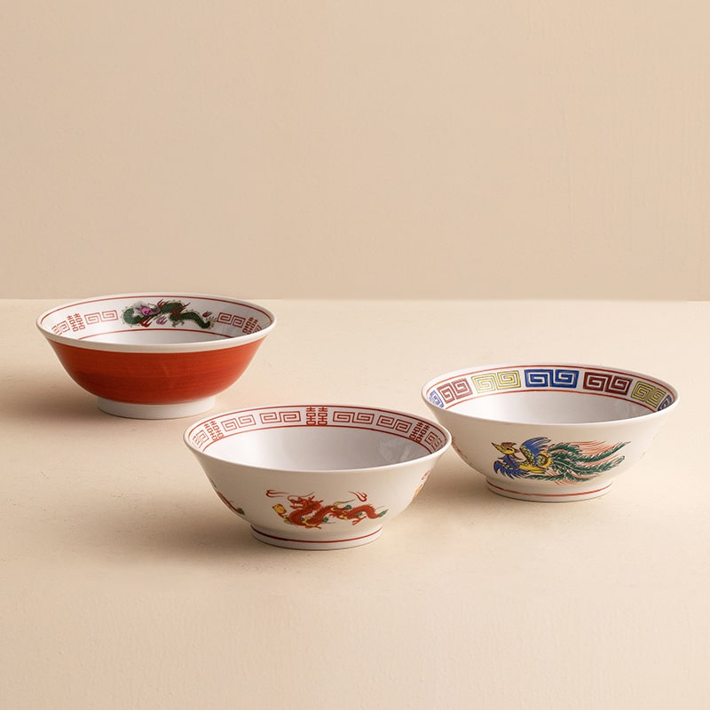 Porcelain bowl featuring a vibrant phoenix design and colorful border