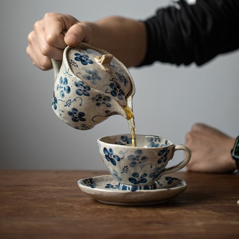 Close-up of a handcrafted ceramic teapot base with Japanese lettering