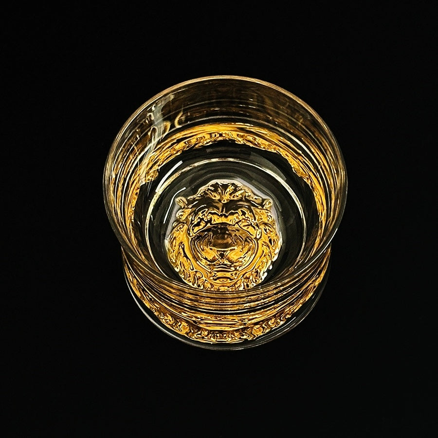 Close-up of handcrafted whiskey glass featuring a sleek design and detailed base.
