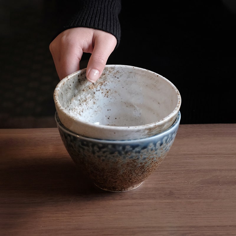 Artisan ceramic bowl held with care for serving meals