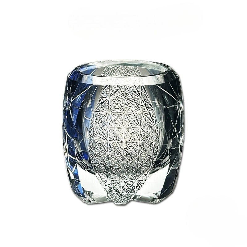 Unique blue and black crystal glass with intricate patterns, perfect for fine whiskey.
