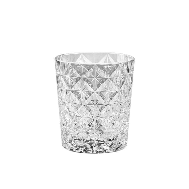 Close-up of Seven Treasures whiskey glass featuring intricate palace-inspired crystal design.
