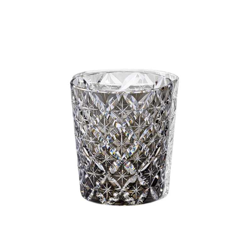 Close-up of Seven Treasures whiskey glass featuring intricate palace-inspired crystal design.
