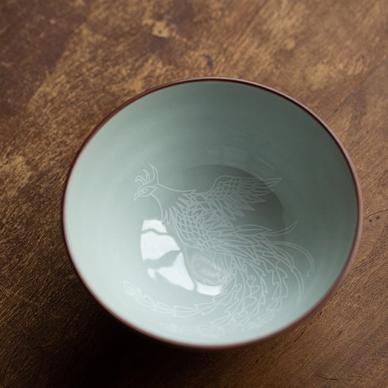 Japanese-inspired ceramic bowl with red dragon pattern