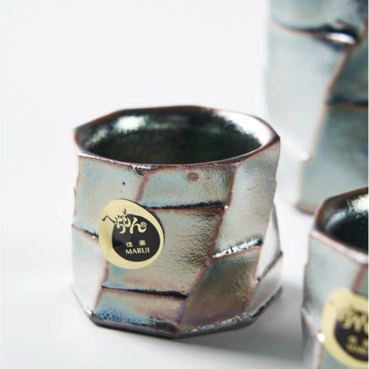 Handcrafted geometric glazed Japanese tea set close-up