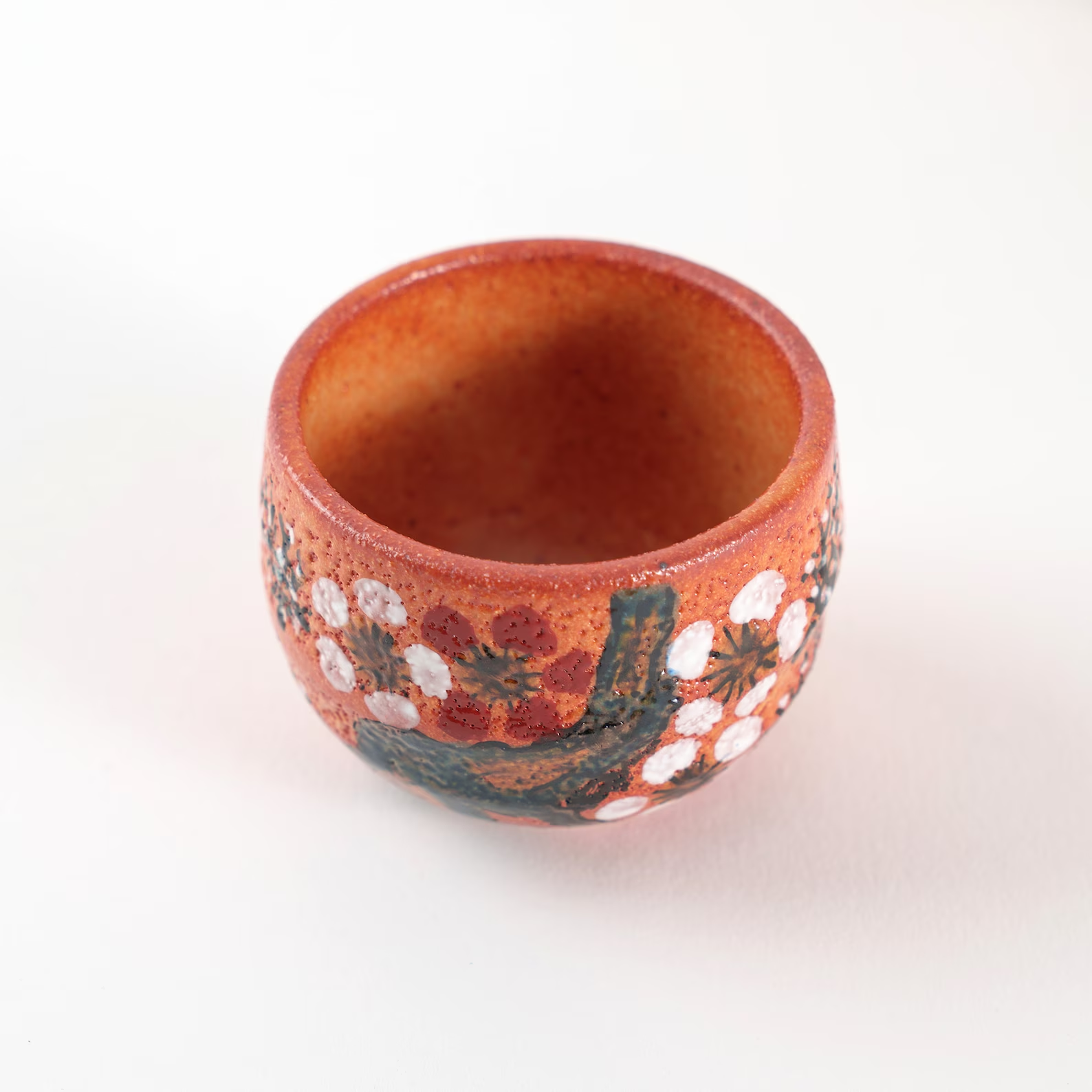 Premium ceramic sake cup set in vivid glaze patterns.
