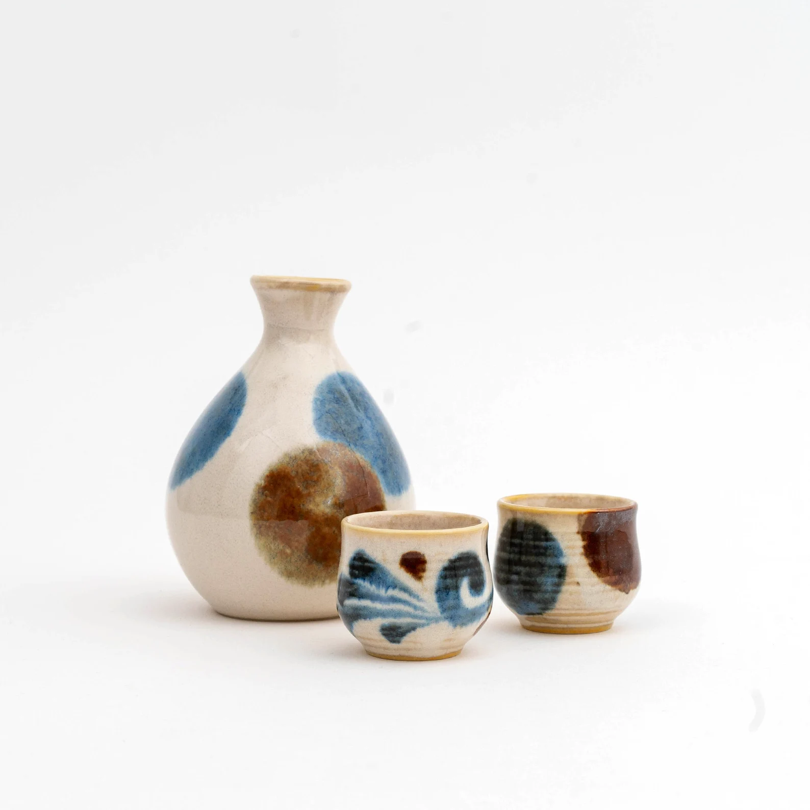 Elegant sake cup set displayed on a polished wooden surface