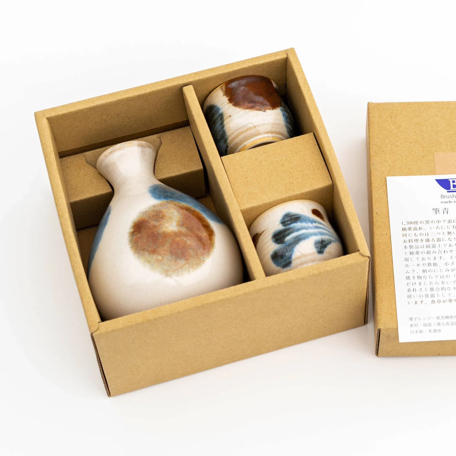 Beautiful sake sets arranged next to delicate sushi rolls