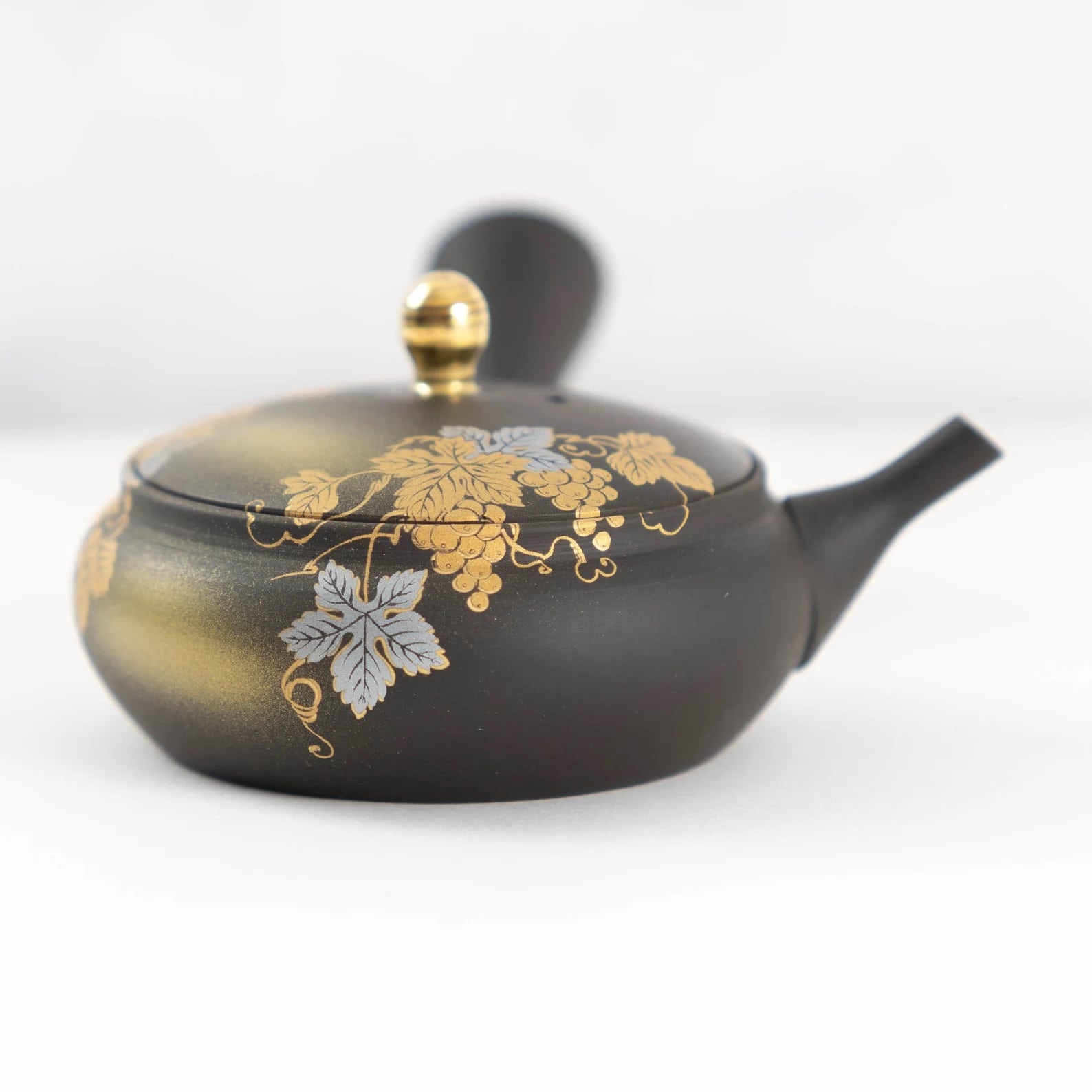 Exquisite Kutani Yaki teapot elevating a traditional sake drinking set