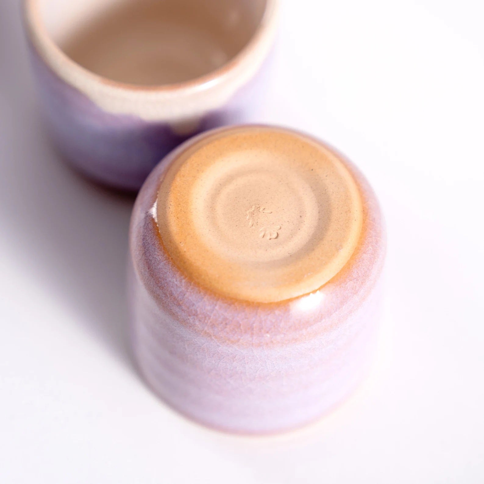 Handcrafted ceramic sake cup set showing delicate texture