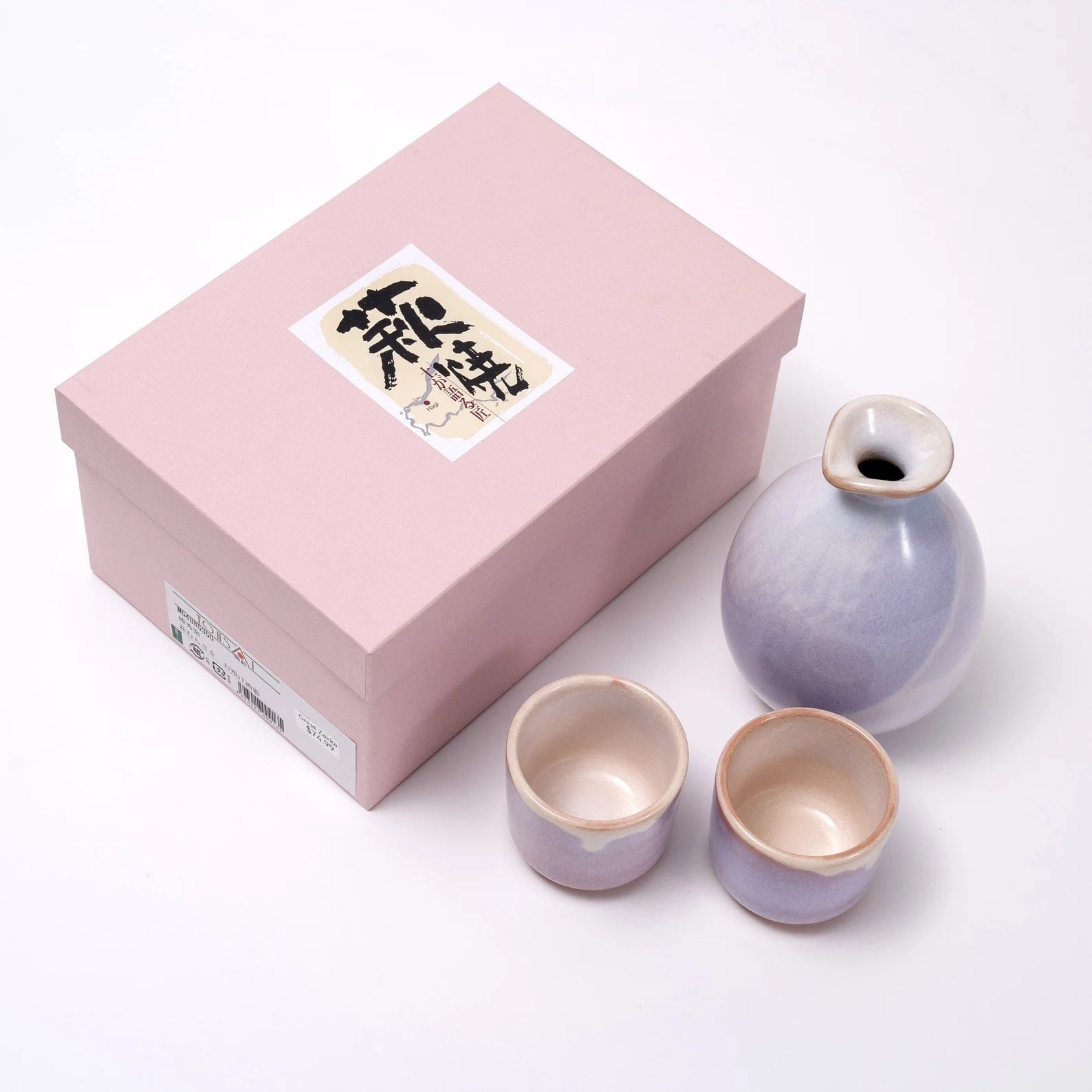 Close-up of artisanal sake set with refined glaze