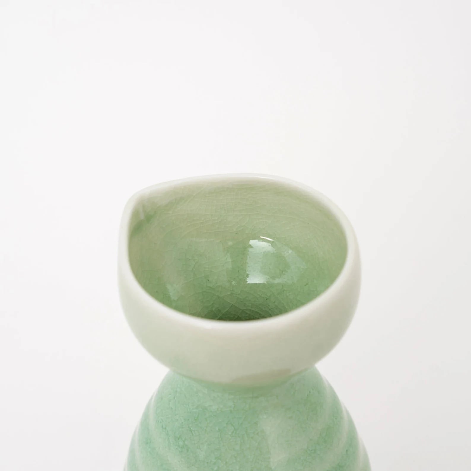 Handcrafted ceramic sake set with green glaze on wooden tray