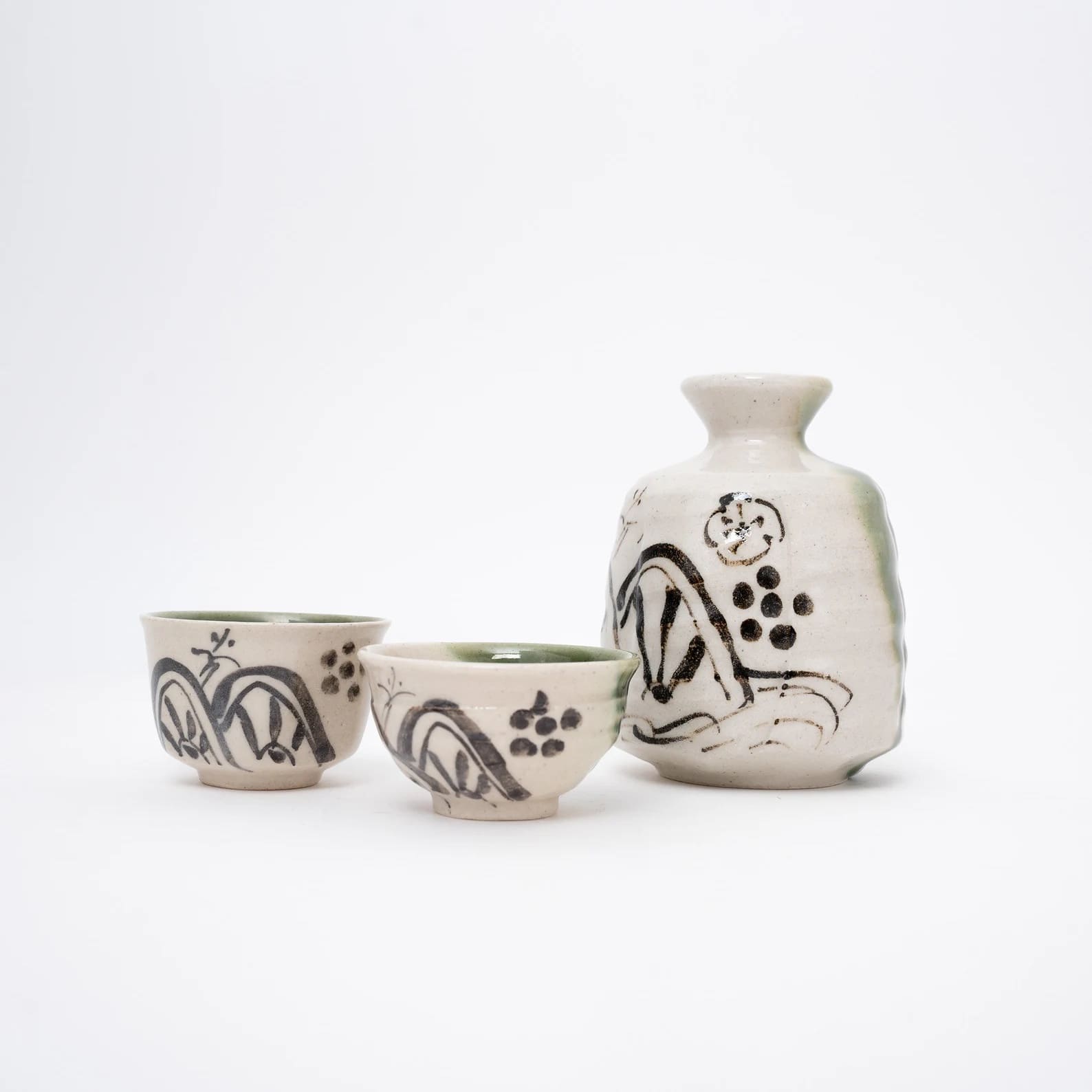 Artisanal ceramic sake set with hand-painted patterns