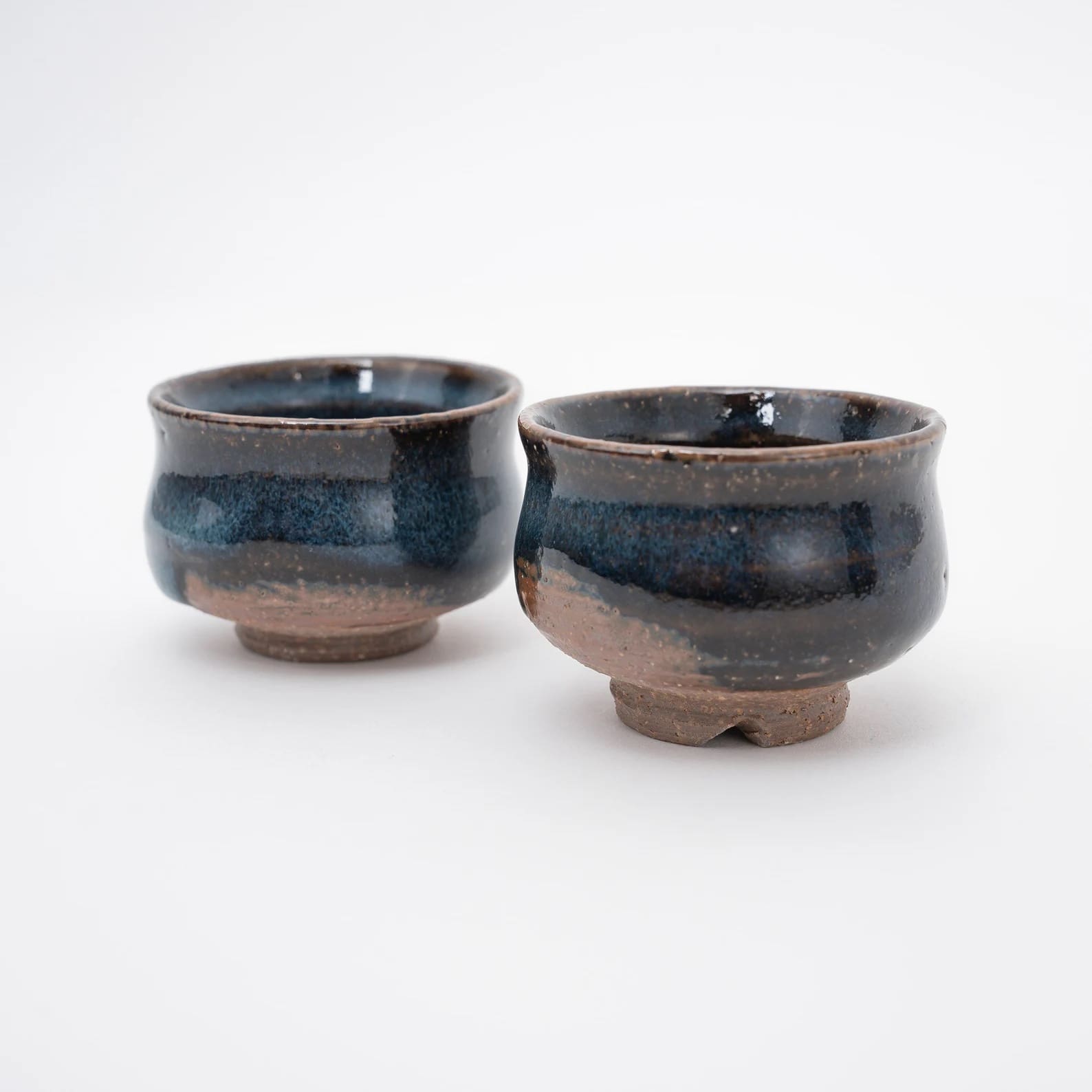 Set sake carafe and cups highlighting artisanal craftsmanship