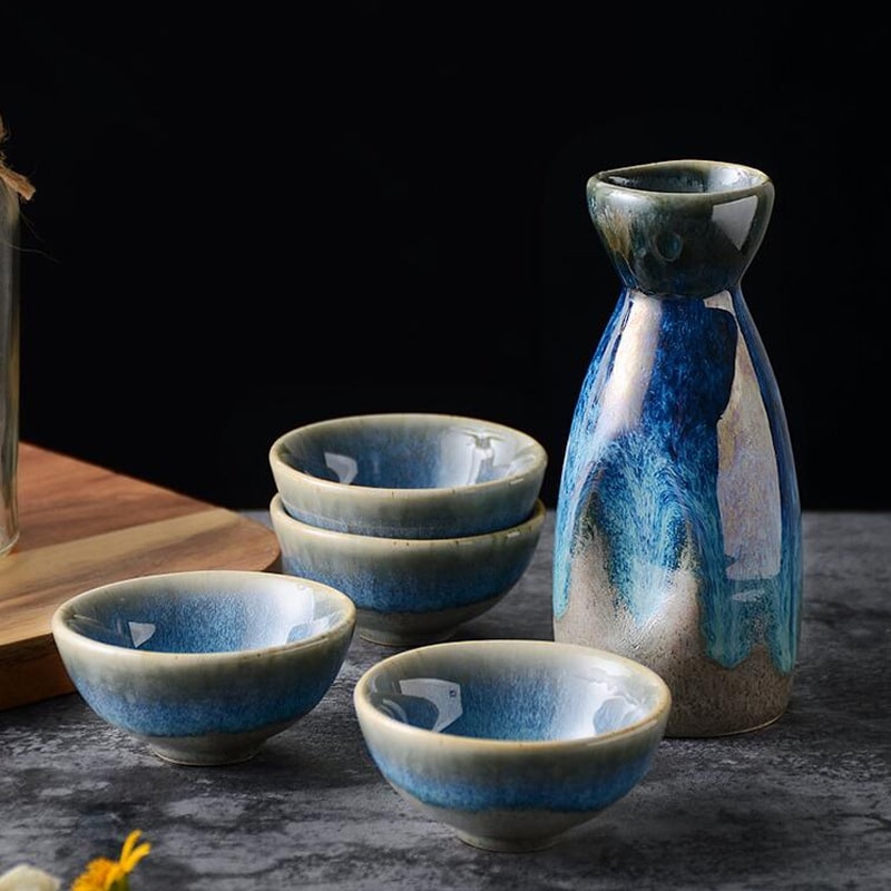 Ceramic sake set with ocean-inspired blue gradient design.
