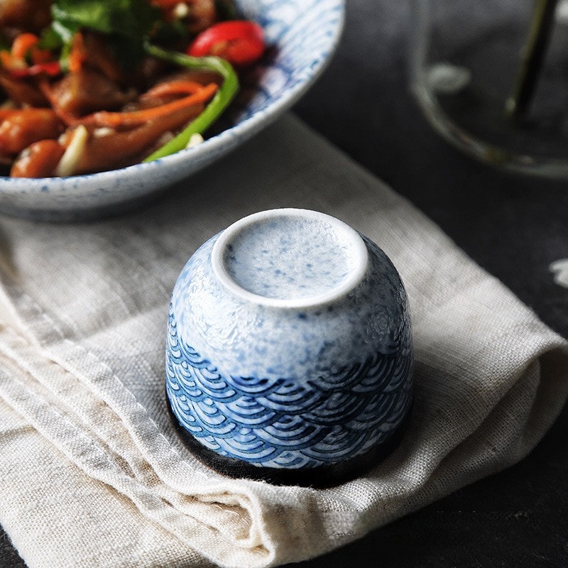 Artistic sake set with traditional blue and white Japanese motifs.
