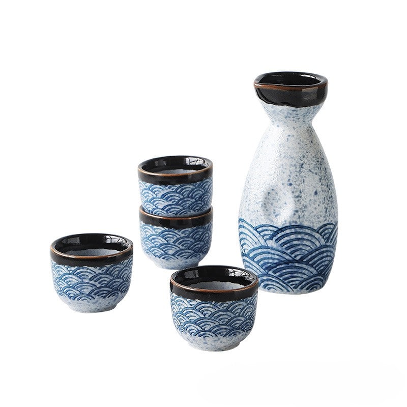 Artistic sake set with traditional blue and white Japanese motifs.
