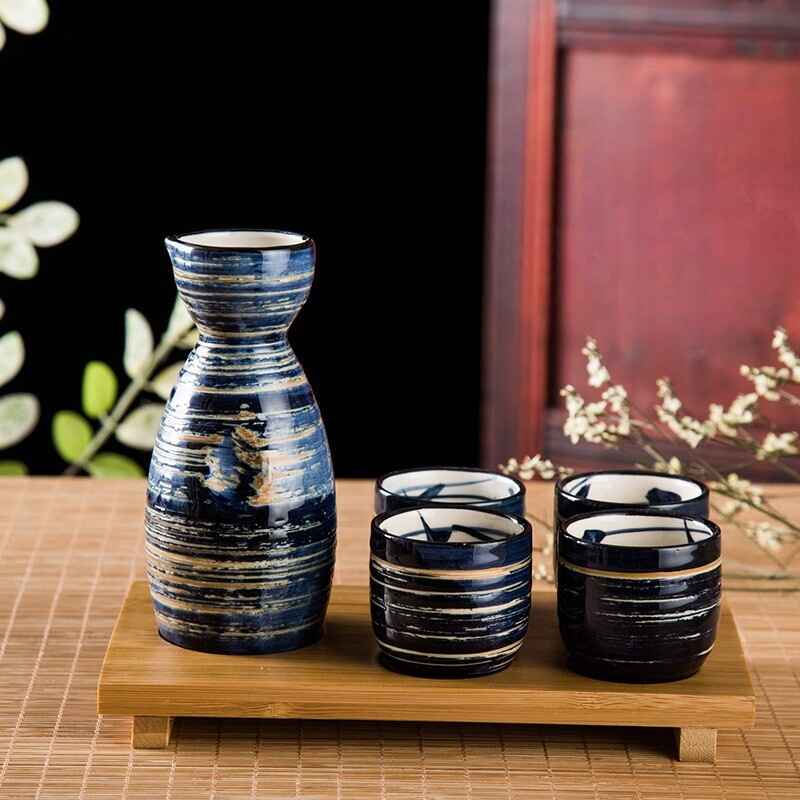 Sake set featuring a bold striped design and delicate floral motifs.
